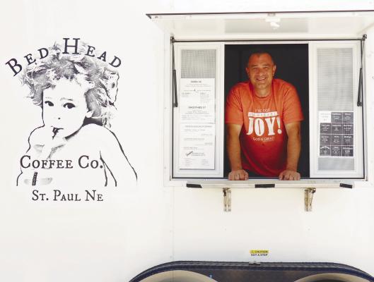 BED HEAD COFFEE CO.’S Donnie Yutesler is pictured inside the business’s newly built mobile coffee shop. The business’s previous mobile shop had caught fire late last year. Photo by Michael Rother