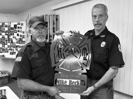 ST. PAUL VOLUNTEER FIRE DEPARTMENT Chief Mike Becker was recently honored for thirty years of service to the department. Chief Becker, who joined the department in 1993, was presented with a honorary plaque by Monty Mrkvicka during the joint meeting of the St. Paul Volunteer Fire Department and St. Paul Rescue Squad. Courtesy Photo