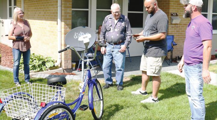 BOB CHRISTENSEN examines his new trike on Friday afternoon.