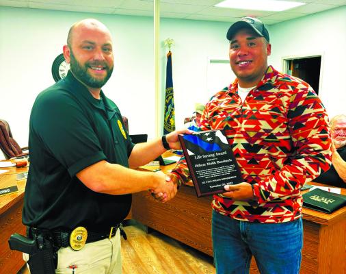 MALIK BEARHEELS was presented a Life Saving Award by St. Paul Chief of Police Dan Howard last week during the St. Paul City Council’s second meeting of the month of November. Photo by Haley Spotanski