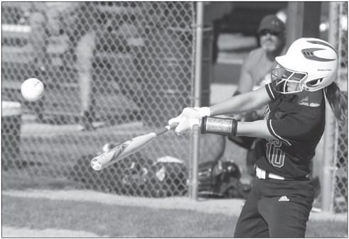 KAYLEY WELLS picks up a hit during last Thursday evening’s softball game against Central City. The Wildcats ended up falling to the Bison 11-4. Photos by Michael Happ