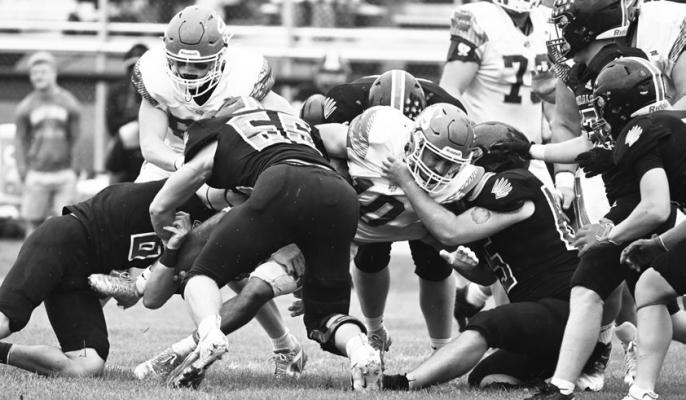 ST. PAUL’S COLTON KUSZAK fights for yards during the second half of last week’s game against Doniphan-Trumbull. Following a lightning delay that postponed Friday night’s game against the Cardinals to Saturday, St. Paul beat Doniphan-Trumbull 36-12. Photos by Michael Happ