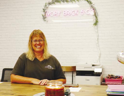 SANDY SPIEHS, who runs Ivory Brick and Co. in St. Paul alongside her daughter, Tara Kosmicki, says she is excited for residents to come in and rediscover what the store has to offer following its July 22nd reopening. Photos by Michael Rother