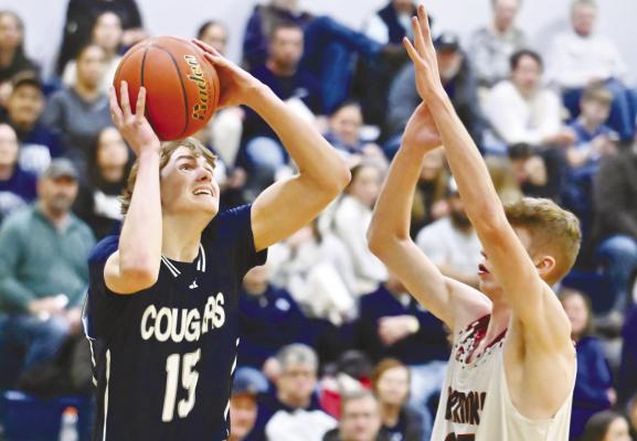 CENTRAL VALLEY’S Zevan Wolf puts up a shot against Fullerton’s Kane Wetovick during the first half of last Thursday’s Goldenrod Conference semifinal game at Central Valley High School. Photo by Michael Happ