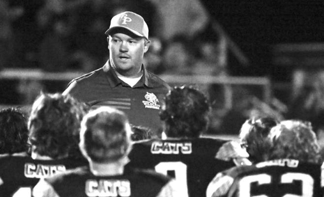ST. PAUL HEAD FOOTBALL COACH COREY VALASEK speaks to the St. Paul High School football team following a game last September. The Wildcats, like the rest of the state’s football teams, learned their 2026 and 2027 schedules last week. Photo by Michael Happ