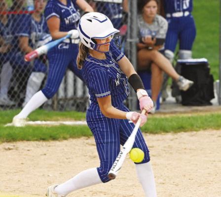 AVERIE PATRICK connects with a pitch and drives the ball to the outfield for a hit in St. Paul’s 7-4 victory over O’Neill last Thursday evening. Photos by Michael Happ