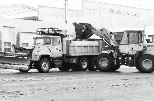 CREWS with the City of St. Paul were busy last Wednesday morning clearing snow and slush from Howard Avenue following a late-season blizzard last week. According to local reports, around four inches of snow fell in the southern portion of the county as a result of the storm. Photo by Michael Rother