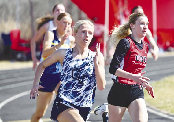 CENTRAL VALLEY’S Taylor McIntyre battled Ord’s Natalie Williams down the stretch in the final heat of the girls’ 200-meter dash on Thursday in Loup City. McIntyre won the gold in that event in 25.92. Photo by Michael Happ