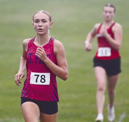 JILLIAN WELLS was one of three Wildcat runners on the girls’ side of the meet to set new personal bests at the Tom Dickey Invite in Albion. Photo by Michael Happ
