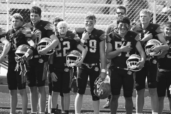 MEMBERS OF THE ST. PAUL HIGH SCHOOL FOOTBALL TEAM