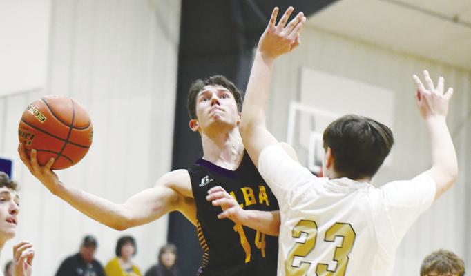 ELBA’S BLAKE BARG fights past Ansley-Litchfield’s Chayton Jensen during last week’s subdistrict semifinal game in Litchfield. Barg had six points to lead the Bluejays against the Spartans. Photos by Jordan Coslor