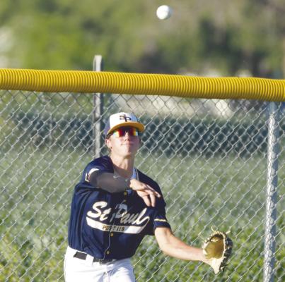 ST. PAUL’S SHANE KOSMICKI makes a throw to the shortstop from left field in an attempt to pick up an out last Wednesday night when the locals battled Central City. Photo by Michael Happ