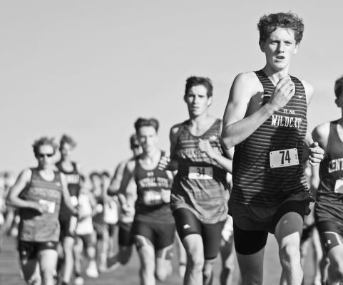 ST. PAUL’S AIDEN LUKASIEWICZ battles for position at the start of last week’s conference cross country race near Gibbon. Lukasiewicz placed twenty-second at the meet. Photos by Jordan Coslor
