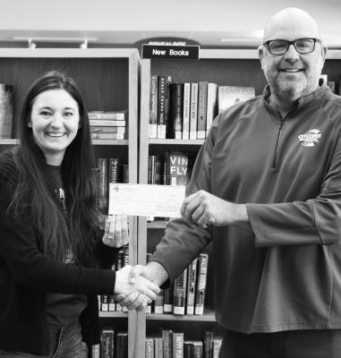 CITIZENS BANK AND TRUST COMPANY of St. Paul recently presented the St. Paul Library with a $500 donation. Making the presentation to St. Paul Library Director Kelli Helton is Citizens Bank President/Trust Officer Jeff Varney. Photo by Michael Rother
