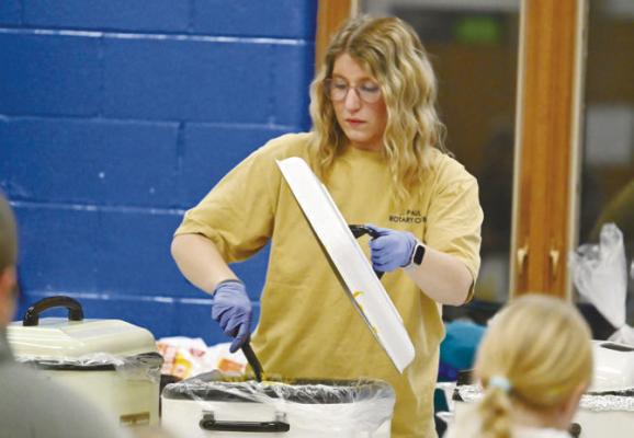 ROTARY CLUB OF ST. PAUL Co-President Elect Keely Huebner helped man the serving line during the Rotary Club’s Taco Night Fundraiser. A large crowd once again attended this year’s event at St. Paul High School. Photos by Michael Happ