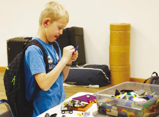 IAN LAWVER was among the many kids who participated in the St. Paul Library’s Lego Club last Thursday afternoon. Lego Club has become a staple of the library’s programing in recent years. Photo by Michael Rother