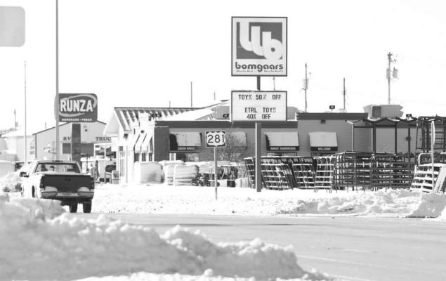 MOTHER NATURE made a statement to start 2023, with a winter storm blowing through much of Nebraska last week. Above, traffic moves along United States Route 281 in St. Paul in the days following the storm, which saw much of the Howard County community having been blanketed with snow. At right, a bell on the south side of the Howard County Historical Village sits amid a snow drift, which was caused by strong northerly winds. (Michael Happ)