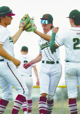 CELEBRATING after a strikeout against Crete last Thursday night in Central City are the Kernels’ Colbyn Peters, Jayden Peterson, and Conner Erickson. Photo by Jordan Coslor
