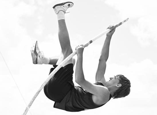 WYATT DVORAK cleared 12-10 in the pole vault, with thunder rolling in the distance, to automatically qualify for the NSAA Class C State Track and Field Championships in that event. Photos by Michael Happ