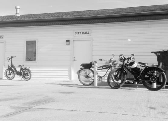 A VARIETY OF BICYCLES, E-BIKES, AND E-SCOOTERS were clustered around the entrance to the St. Paul City Council Chambers last Monday night. A large group of riding enthusiasts and stakeholders attended the meeting to discuss an ordinance concerning the driving of the conveyances within the city. Photo by Michael Happ