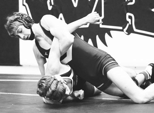 LAYNE BAKER works to pin Hastings St. Cecilia’s Isaac Kiehl during the quarterfinals of the Wood River Invite. Baker won the match by pin in seventy-six seconds. Photo by Jordan Coslor