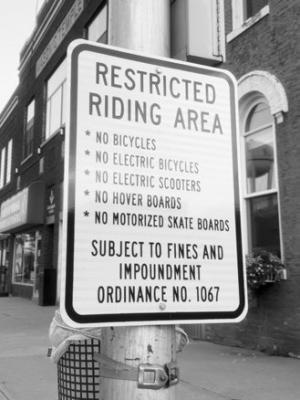 THE CITY OF ST. PAUL recently installed a series of signs in the city’s central business district marking the city’s new restricted riding area. Following the passage of Ordinance 1067 by the St. Paul City Council in July, multiple modes of transportation are now restricted in the designated area downtown. Photo by Michael Happ
