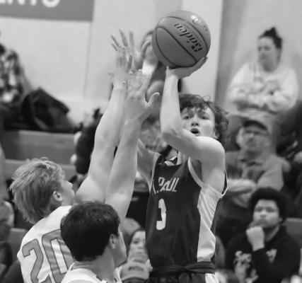 JOEL SHAFER puts up a shot during the first half of Friday night’s game against Arcadia/Loup City. Photo by Jordan Coslor