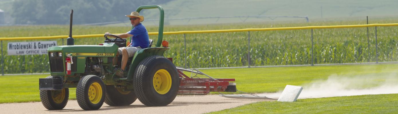 CITY OF ST. PAUL PARKS SUPERINTENDENT RANDY JERABEK works to drag the basepaths between games during the Area C-6 American Legion Baseball Tournament on July 26th. Photo by Michael Happ
