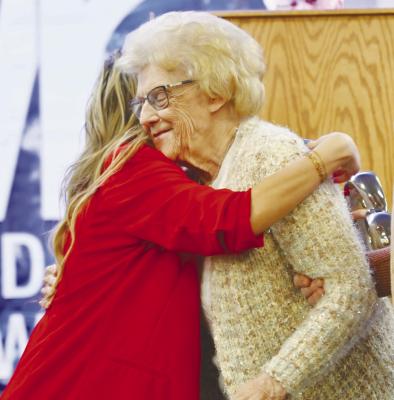 JOANN URBANSKI embraces St. Paul Area Chamber of Commerce Event Chair Melissa Butt after Jim’s Truck Stop in St. Paul was honored by the chamber as the 2025 Business of the Year on Saturday night. Photos by Michael Happ
