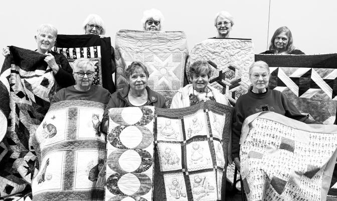 SHOWING OFF THEIR QUILTS during their November meeting earlier this month were (back row): Nancy Psota, Betty Van Dyke, Pat Kuchta, Marilyn Schmaljohn, and Linda Kanter; and (front row): Dee Kuszak, Julie Rodney, Audrey Sonney, and Marylyn Sharron. Courtesy Photo