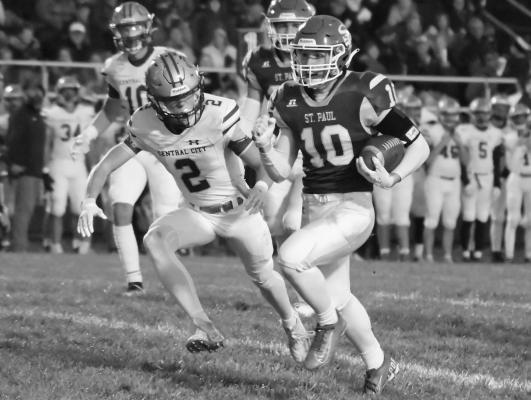 JOHN PLACKE carried the ball seven times during St. Paul’s first drive of Friday night’s game against Central City. The drive ended with Placke scoring on a four-yard carry. (Michael Happ)