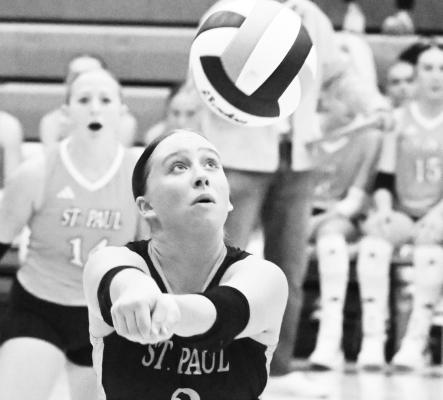 KEISLYN POSS digs up a shot from Doniphan-Trumbull last Thursday night during the Wildcats’ match against the Cardinals. Photos by Michael Happ