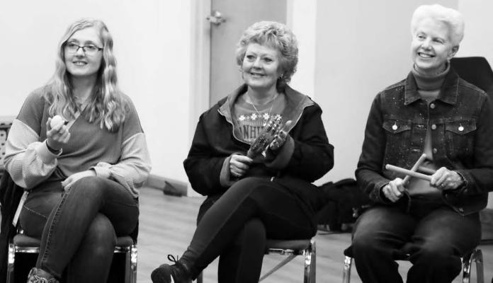 PARTICIPANTS in last week’s event sponsored by the St. Paul CARE Team, including Leanna Pollock, Deidra Hurlburt, and Julie Moore, jammed out during the event held at the St. Paul Library’s community room. Photos by Michael Happ