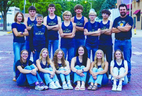 ST. PAUL CROSS COUNTRY: Members of the St. Paul cross country team include (back row): Assist Coach Steph Miller, Eli Sladek, Rhyder Holder, Aiden Lukasiewicz, Evan Gregoski, Tate Busch, Cayden Helmer, Anthony Sanchez, and Head Coach Don Kleinsasser; (front row): Julia Kleinsasser, Braelyn Muller, Alexis Galusha, Katie Kleinsasser, Jillian Wells, and Autumn Doncheske. Photo courtesy of Rita’s Photography