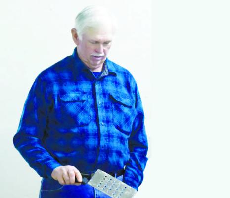 DAN MCCARTY helped work the griddle during Sunday morning’s pancake feed at the Howard County Fairgrounds. Photo by Michael Happ
