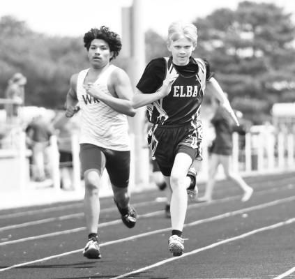 ELBA’S Garrett Wells battled Byron Guerrero down the stretch in the boys’ 400-meter dash at last week’s Shelton Invite. The Bluejay finished the race sitting in fifteenth. Photos by Jordan Coslor