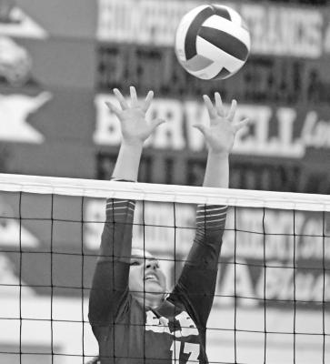 MAYCEE RADKE goes for a block during last Tuesday’s match between the Elba Bluejays and the Flyers from Humphrey St. Francis. Photo by Michael Happ