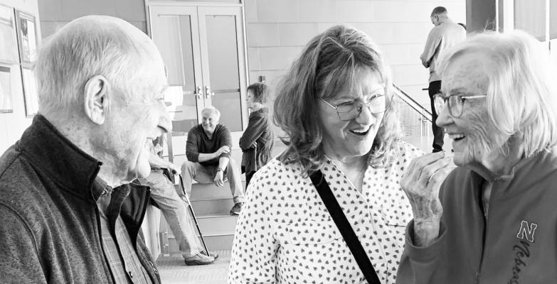 FORMER ST PAUL RESIDENT Ray Ringlein visits with Donna Trompke of Loup City and Dean Cole of Lincoln during the “Once Upon a Time” exhibit at the University of Lincoln’s Innovation Campus. Courtesy Photos