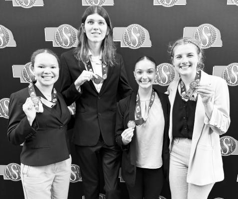 CENTURA HIGH SCHOOL STUDENTS Ella Simon, David Hadenfeldt, Lauren Suntych, and Hope McDonald show off the hardware they won at last month’s NSAA Class C-1 State Speech Championships in Kearney. Courtesy Photo
