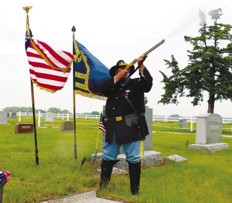 RICK MARX, a member of the SUVCW, concluded last week’s Last Soldier dedication ceremony with a gun salute from a vintage Henry rifle at the grave of Leander Herron. Photo by Michael Rother