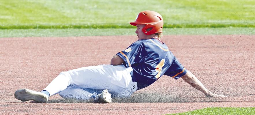ST. PAUL/PALMER’S Christian Lemburg attempts to steal second base during last week’s district final game against Adams Central. The Cats lost to the Patriots 9-1. Photos by Michael Happ
