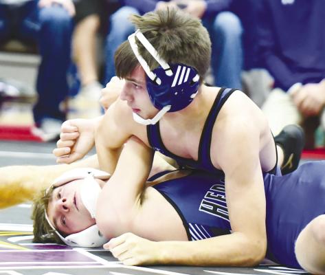 ST. PAUL’S DERRICK RUZICKA pinned Hershey’s Jarrett Canarsdall in the first period of Friday’s quarterfinals at the Wood River Invite. Photos by Jordan Coslor