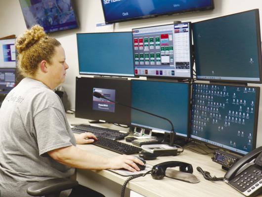 HOWARD COUNTY COMMUNICATIONS is three months into its effort to answer emergency calls for Nance County as a local Public Safety Answering Point. Above, Chief Dispatcher Melissa Paxton mans one of the dispatch stations. Photo by Michael Rother