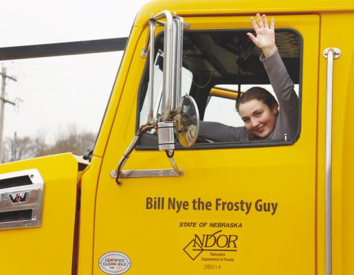 KYNLEE ENCINGER, a fifth grader at Elba Public Schools, is pictured inside the snowplow she named: Bill Nye the Frosty Guy. Photo by Michael Rother