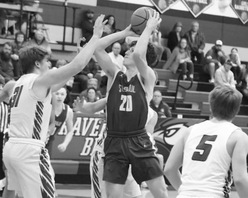 SHANE KOSMICKI goes up for two points in the first half of last week’s game between the Wildcats and the Ravenna Bluejays. Photos by Michael Happ