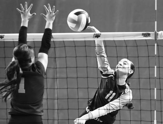 CENTRAL VALLEY’S Bentleigh Dugan goes for a kill against Leyton’s Zaili Benish during Friday’s semifinal match in Lincoln. Photos by Jordan Coslor
