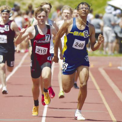 ST. PAUL’S CHRISTOPHER THOMAS battled Perkins County’s Mason McGreer to the finish line in the boys’ 800-meter run on Saturday. Thomas won that race in 1:57.90. Photos by Michael Happ