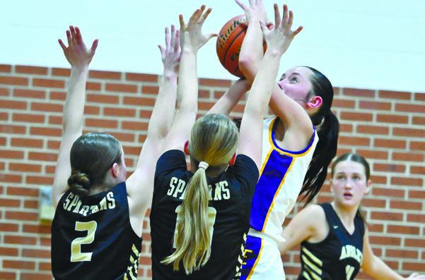JARAHLYNN MORROW rises above the Ansley-Litchfield defense on her way to the rim during the fourth quarter of last Tuesday’s game between the Bluejays and the Spartans. Photos by Michael Happ