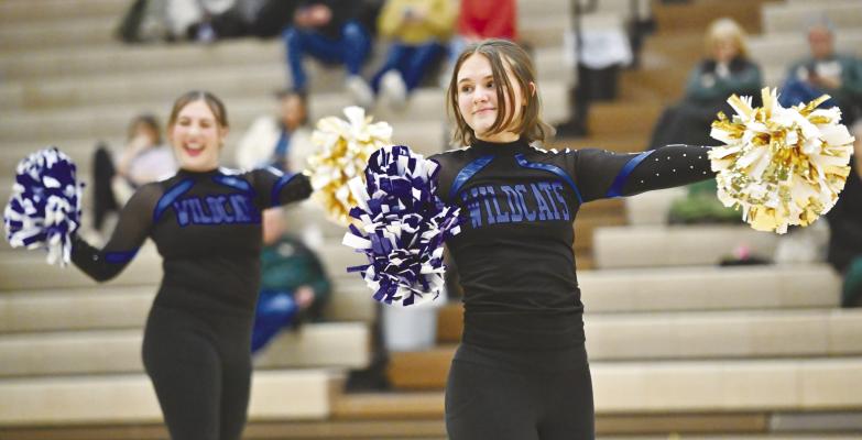 THE ST. PAUL DANCE TEAM took to center court last Tuesday night during halftime of the St. Paul Wildcats’ game against Central City. Performing as a part of the team last week were Audrey Anderson and Anneberlyn McClay. The team has provided entertainment during games multiple times so far this winter sports season. Photo by Michael Happ