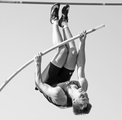 CALVIN ZIMMERMAN vaulted past 13-00 on Saturday morning to secure a fifth place finish in the boys’ pole vault. Zimmerman’s efforts helped Centura to a twenty-first place finish in the team race. (Michael Happ)